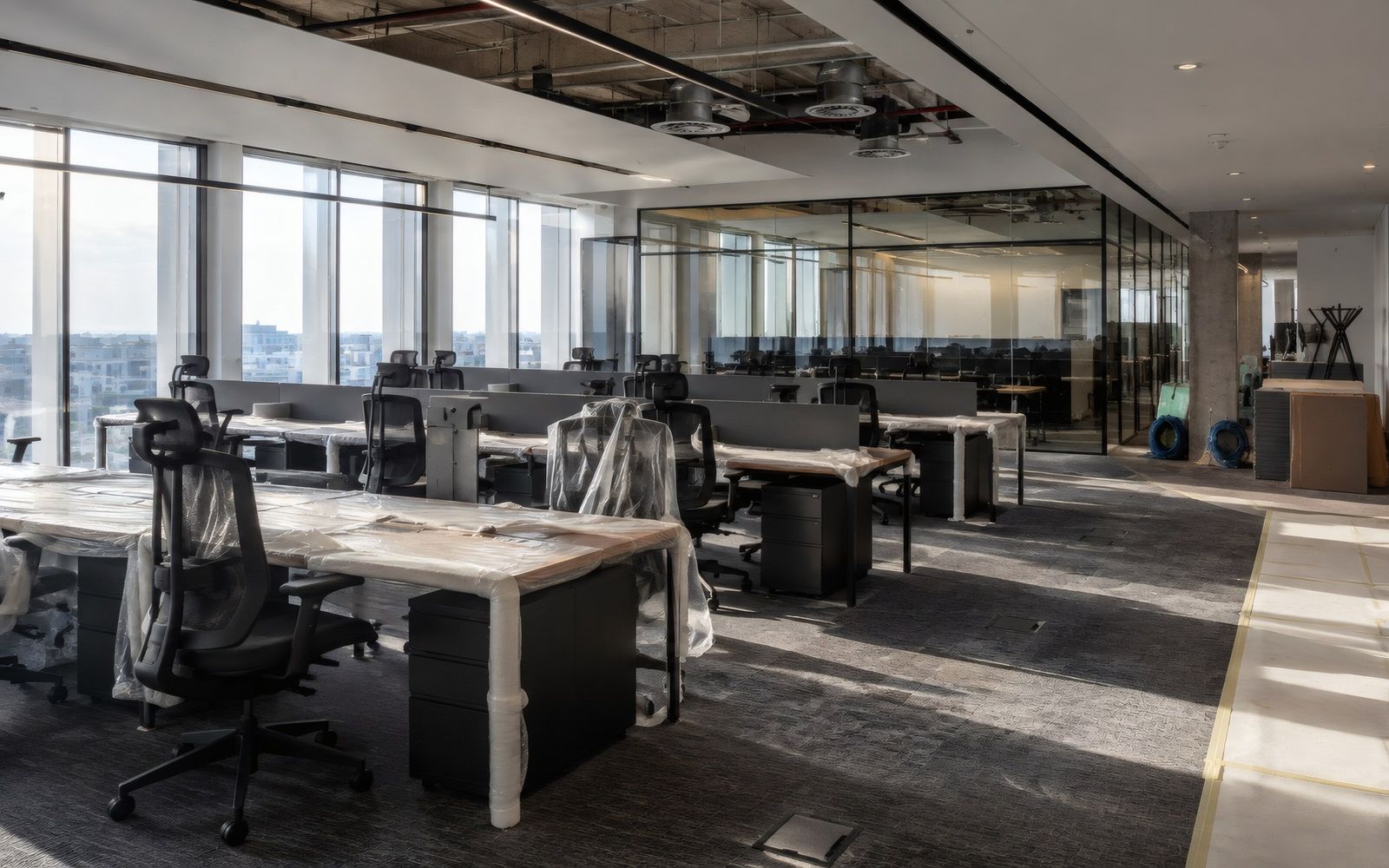 Open-plan office floor with rows of desks