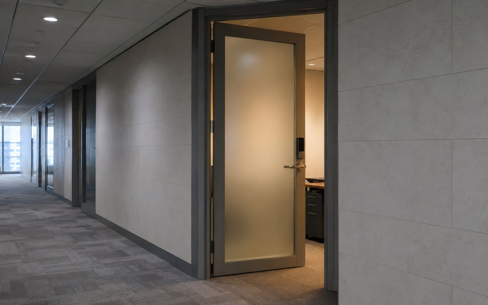 Frosted glass door in a quiet office corridor